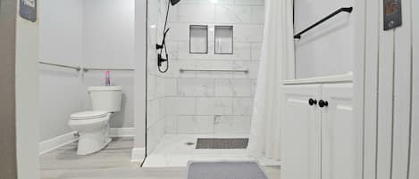 Shower, hair dryer, towels, soap