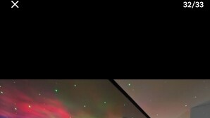 A modern bedroom with a bed, red and white bedding, a ceiling projector, and a starry night effect. - Beautiful apartment in Tours center, panoramic view of the city. (Tours)