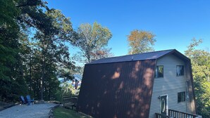 A small cabin with a sloped roof, a deck, and a gravel path leading to it. - Charming A-frame with Lake Cumberland Views (Jamestown)