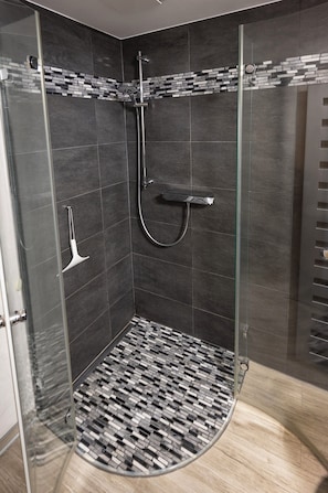 Shower, hair dryer, towels, soap