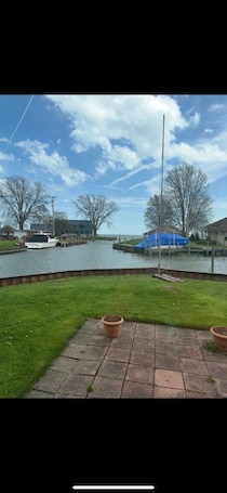 Property grounds. Cozy 2-bedroom bungalow on Lake St Clair with plenty of room to dock your boat!
