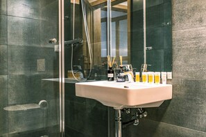 Shower, towels, soap, toilet paper