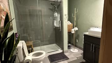 Shower, hair dryer, towels, soap