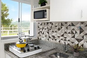 Classic Apartment | Private kitchen | Fridge, microwave, stovetop, cookware/dishes/utensils