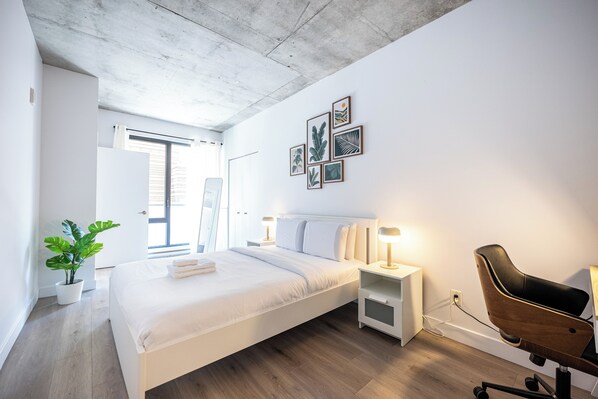 1 bedroom, desk, iron/ironing board, travel crib