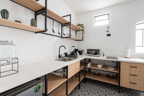 Fridge, microwave, coffee/tea maker, toaster