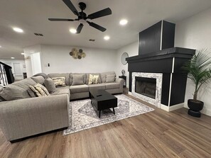 Smart TV, fireplace, books