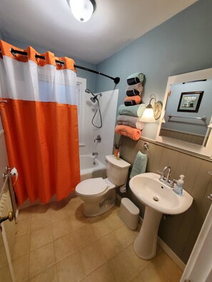 Shower, hair dryer, towels, soap