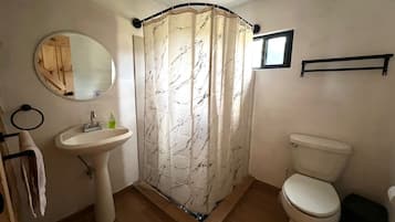 Shower, towels, soap, toilet paper