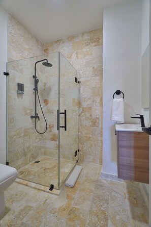Shower, hair dryer, towels, soap