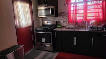 Family Apartment, Garden View | Private kitchen | Fridge, microwave, stovetop, cookware/dishes/utensils