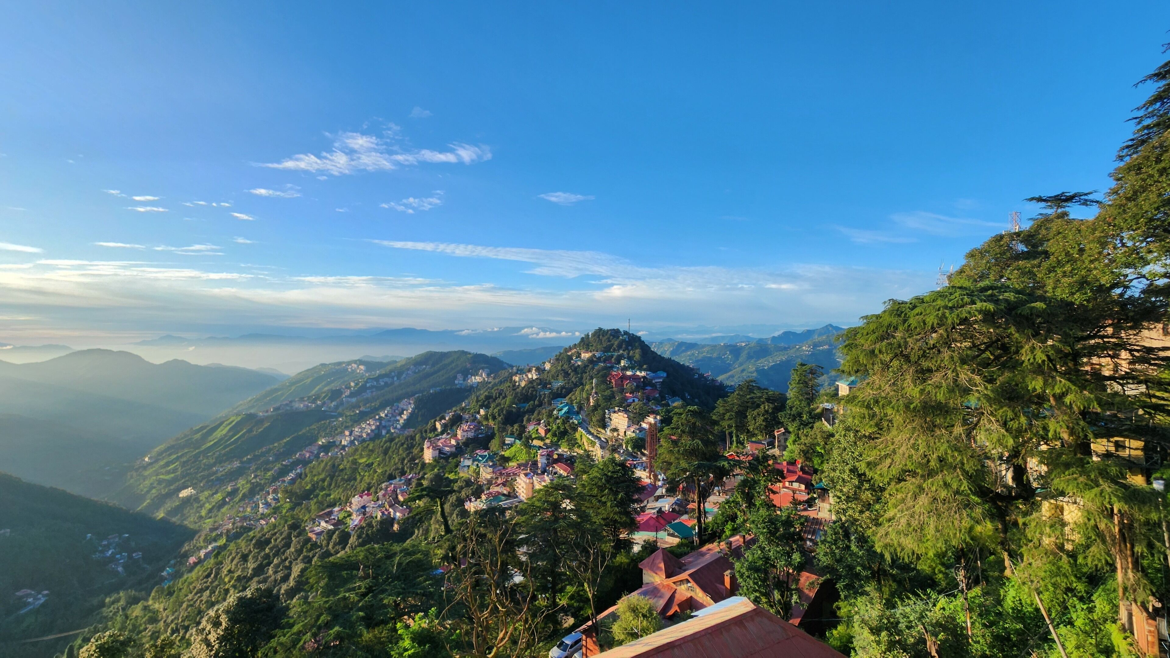 A mountainous landscape with a village nestled among the hills.