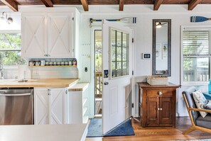 A kitchen with white cabinetry, a wooden countertop, and a built-in dishwasher. - Oak Island Escape-2nd Row, Pet-Friendly w/ Ocean Views & Boat Ramp Nearby (Oak Island)