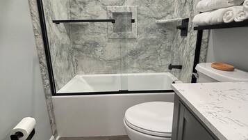 Shower, hair dryer, towels, soap
