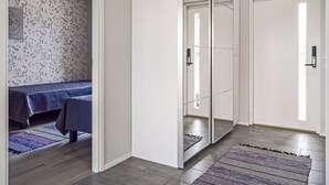 A room with a bed, a wardrobe, and a mirror. - Tervaleppä by Interhome (Ikaalinen)