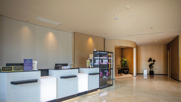 A modern reception area with a glass display case, a reception desk, and a clean, polished floor. - E-sports Wanyoo Hongkou  Shanghai (Shanghai)