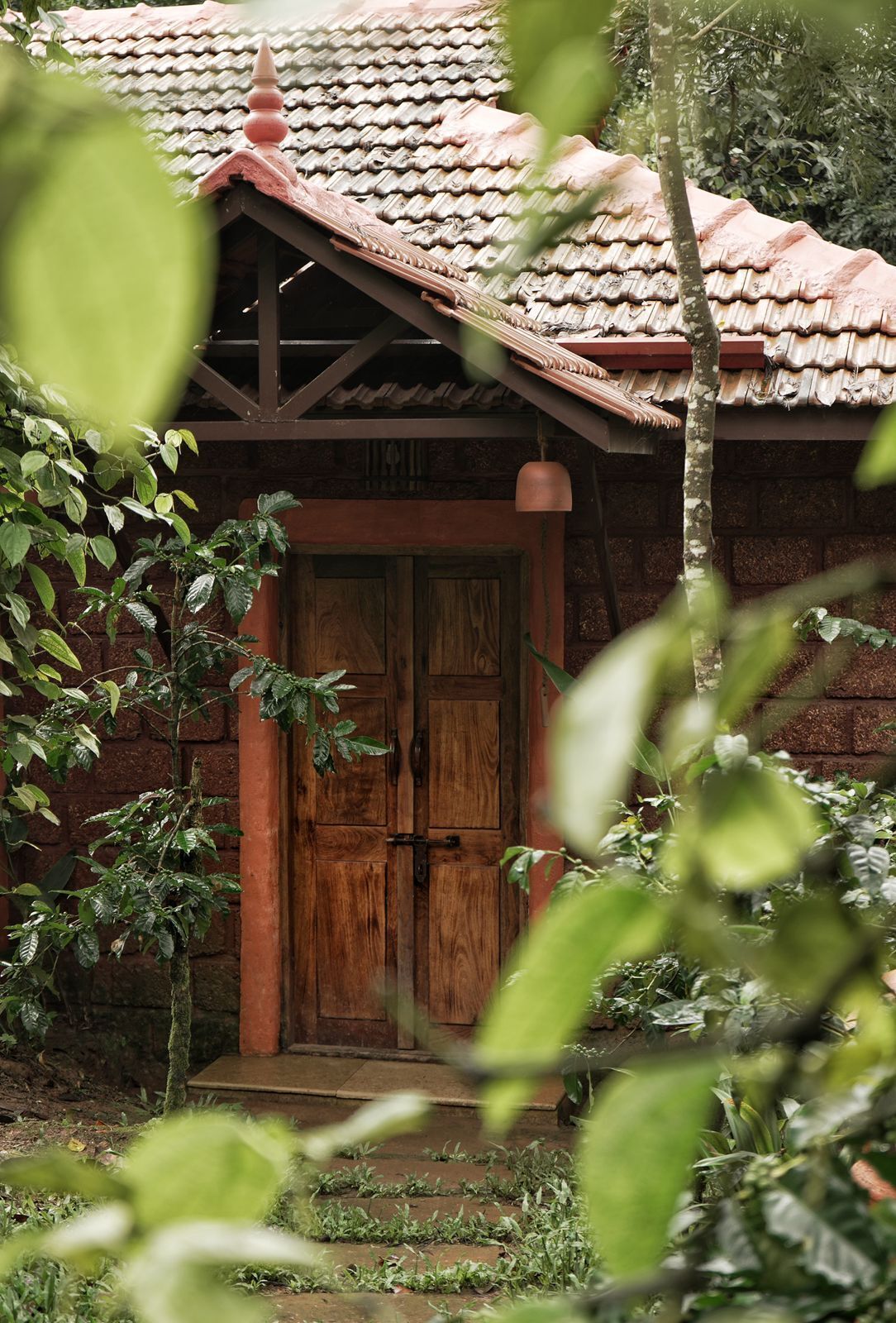 A traditional wooden building with a tiled roof and a wooden door.