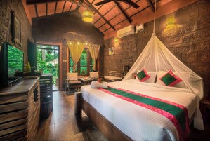 Standard Cottage, Garden View | Premium bedding, minibar, in-room safe, laptop workspace