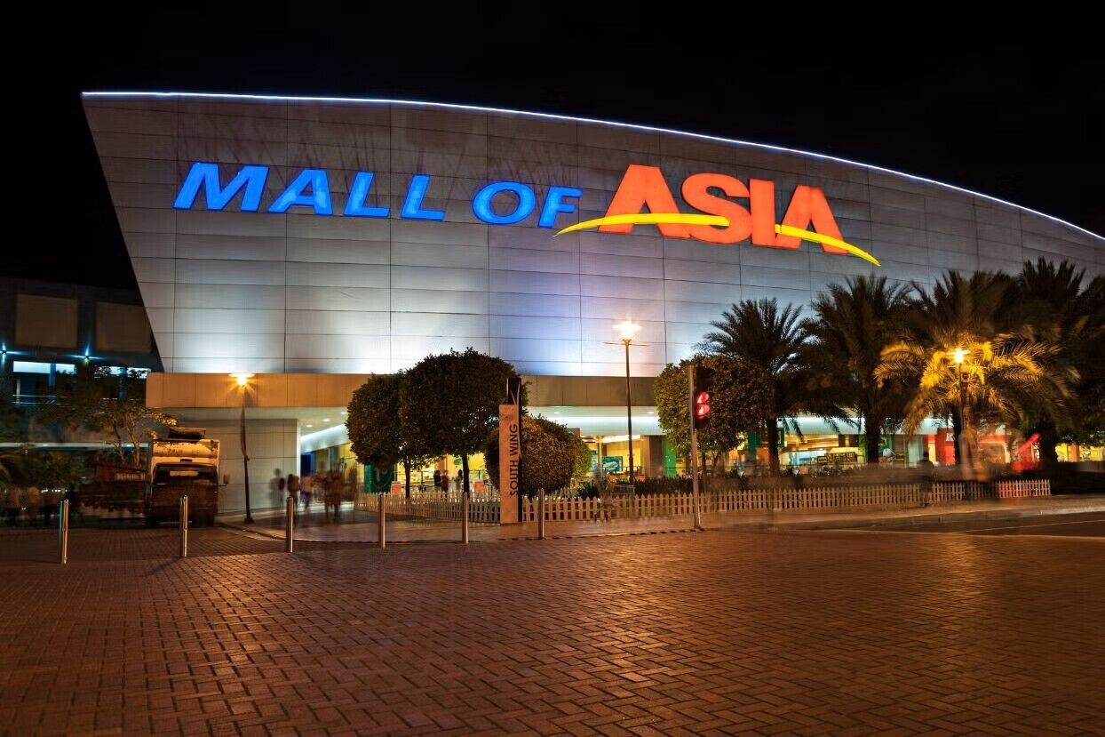 A modern building with the sign "MALL OF ASIA" prominently displayed.