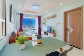 Desk, laptop workspace, blackout curtains, soundproofing - Botanica Premier Serviced Apartment (Tan Binh)