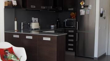 Fridge, microwave, cookware/dishes/utensils