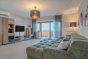 Family Apartment, Multiple Bedrooms (Seaview Apartment Double D) | Living area | 19-inch flat-screen TV with cable channels, fireplace - Seaview Apartment Double D (Koper)