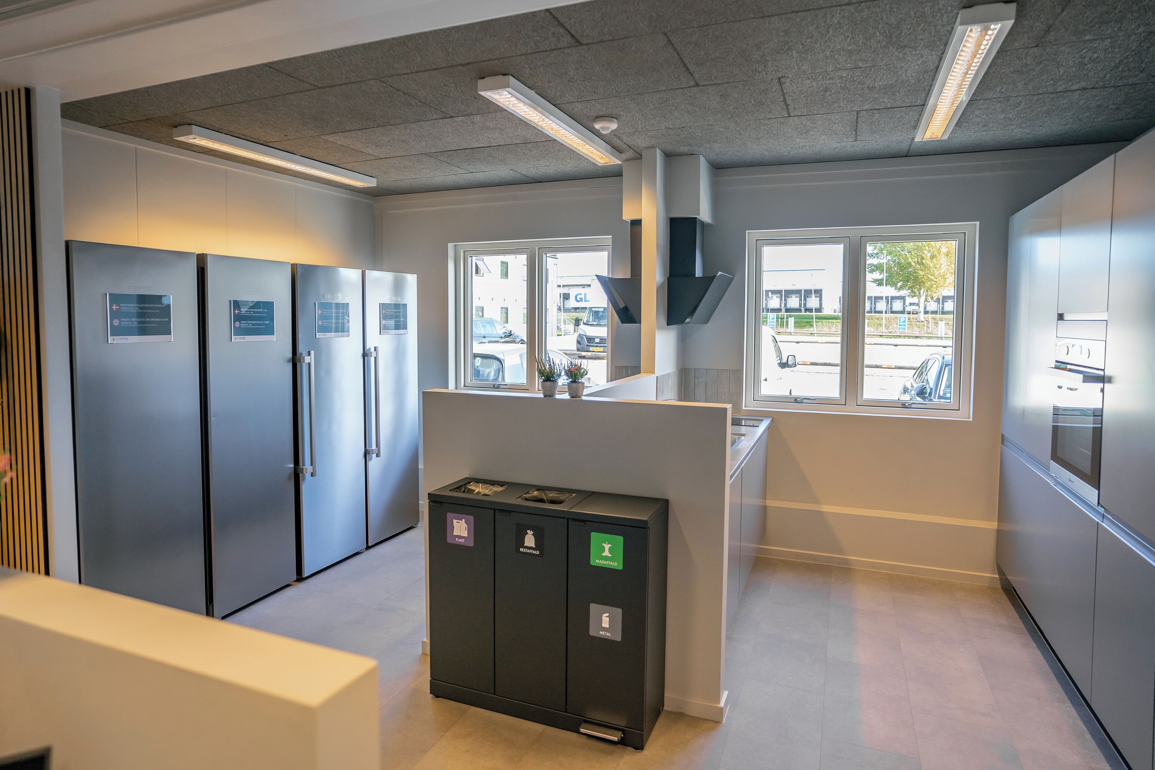 Fridge, microwave, cleaning supplies, paper towels