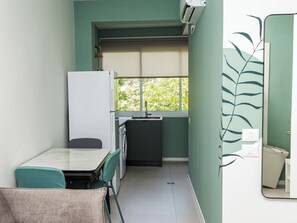 Design Apartment | Private kitchen | Full-size fridge, microwave, oven, stovetop