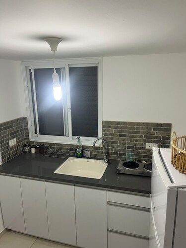 Renovated one room unit with a bomb shelter and a garden.