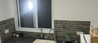 Renovated one room unit with a bomb shelter and a garden.