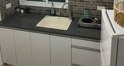 Renovated one room unit with a bomb shelter and a garden.