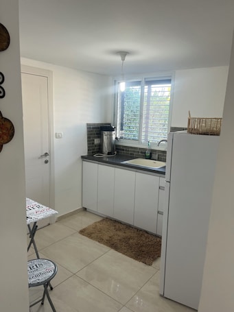 Interior. Renovated one room unit with a bomb shelter and a garden.