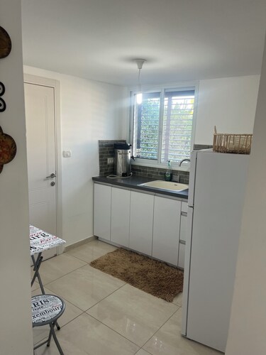 Renovated one room unit with a bomb shelter and a garden.