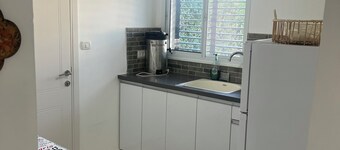 Renovated one room unit with a bomb shelter and a garden.