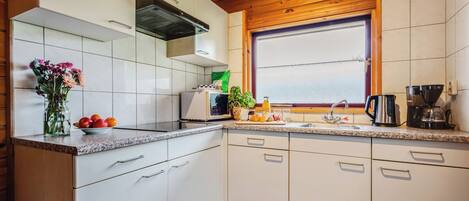 Fridge, stovetop, coffee/tea maker, dining tables