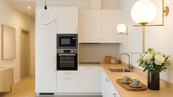 Deluxe Apartment, Courtyard View | Private kitchen | Espresso maker, electric kettle, toaster, freezer