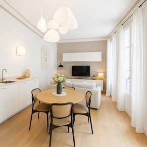Deluxe Apartment, Courtyard View | Living area | 80-cm Smart TV with digital channels