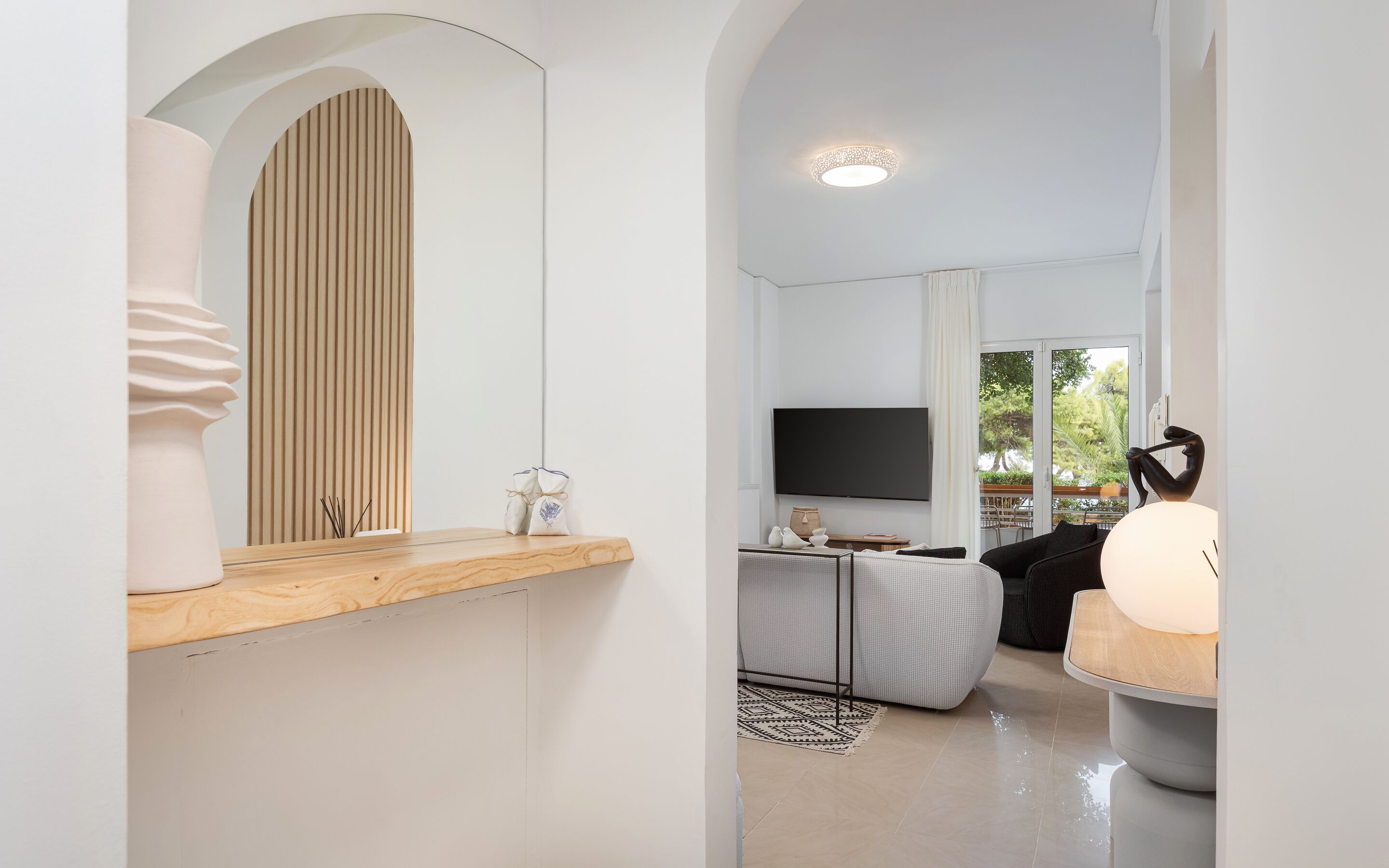 Deluxe Apartment, Balcony, Sea View | Living area | 55-inch Smart TV with satellite channels