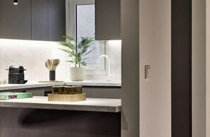 Deluxe Apartment, Balcony, Sea View | In-room safe, blackout drapes, soundproofing, iron/ironing board