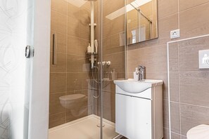 Shower, hair dryer, towels, soap