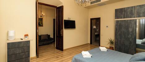 Design Suite | Living area | 120-cm Smart TV with satellite channels, video game console, printers