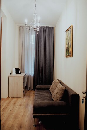 Design Suite | Living area | 120-cm Smart TV with satellite channels, video-game console, printers
