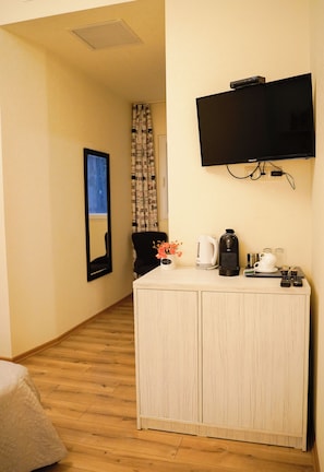 Economy Double Room, Courtyard View | Living area | 120-cm Smart TV with satellite channels, video-game console, printers