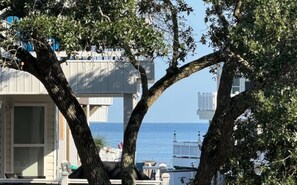 A view of the ocean from a main level veranda with a 2.5-minute walk to the beach. - Ocean Lakes 5BR Beach House | Sleeps 12 | Golf Cart | Steps to Beach (Myrtle Beach)