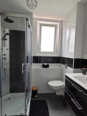 Shower, hair dryer, towels, soap