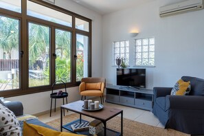 Apartment, 2 Bedrooms, Kitchen, Pool View | Living room | 43-inch Smart TV with digital channels, streaming services