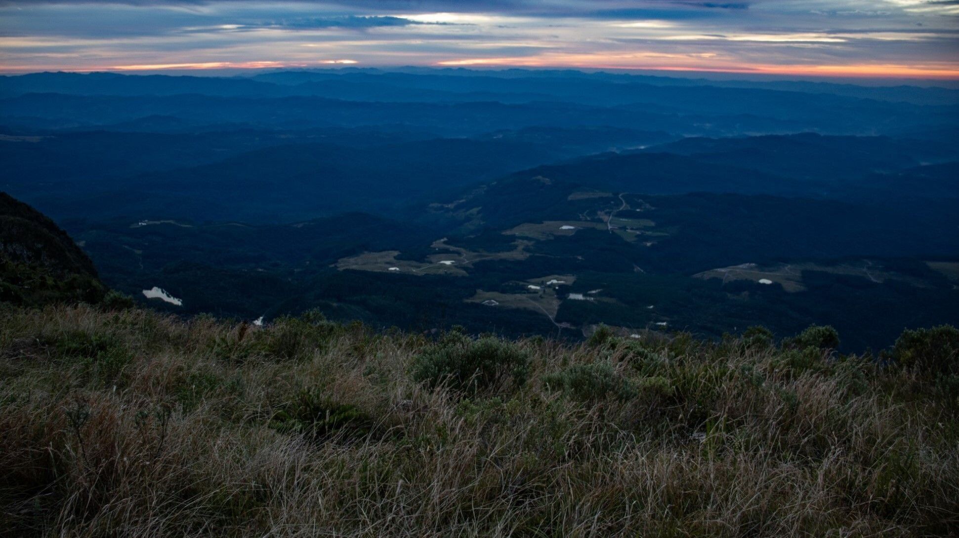 A mountainous landscape with a view of distant hills and valleys.