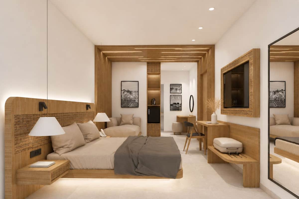 Ein modernes Schlafzimmer mit einem großen Bett, Nachttischen, einem Schreibtisch und einem Spiegel.