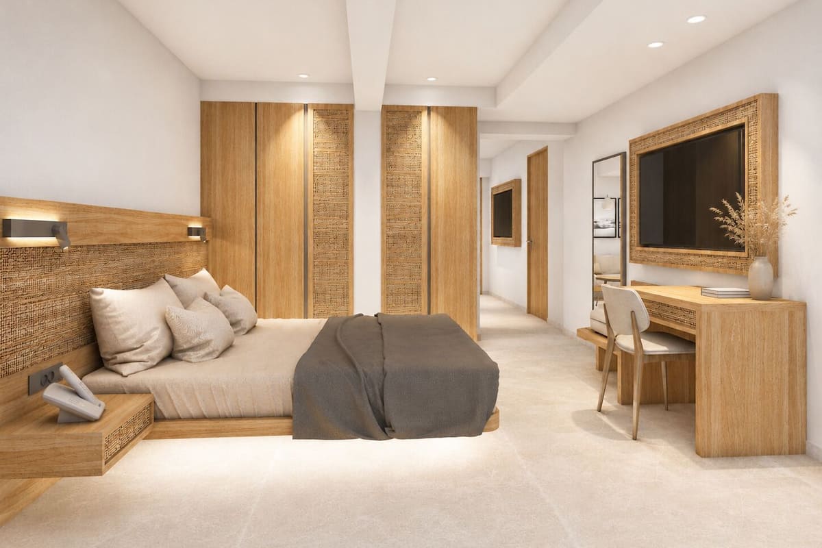 Ein modernes Schlafzimmer mit Bett, Nachttisch, Schreibtisch, Stuhl und einem großen Spiegel.