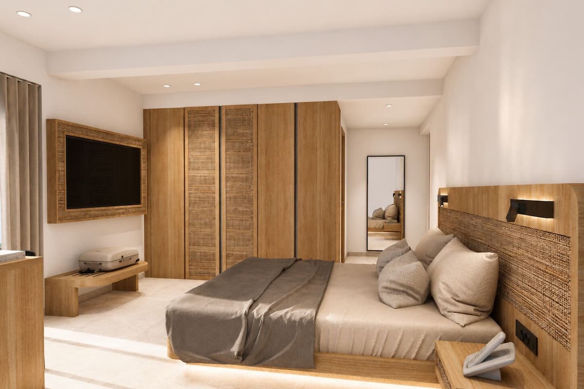 Ein modernes Schlafzimmer mit einem großen Bett, einem Fernseher, einem Kleiderschrank und einem Nachttisch.